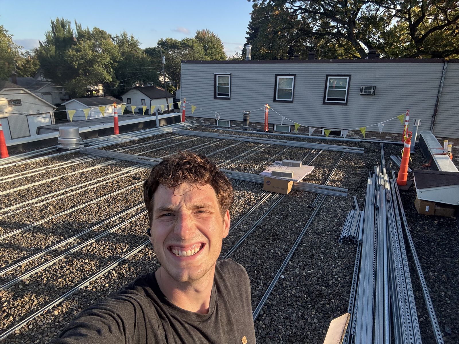 Jacob Bechtold, founder of Great Lakes Solar, on a commercial rooftop project