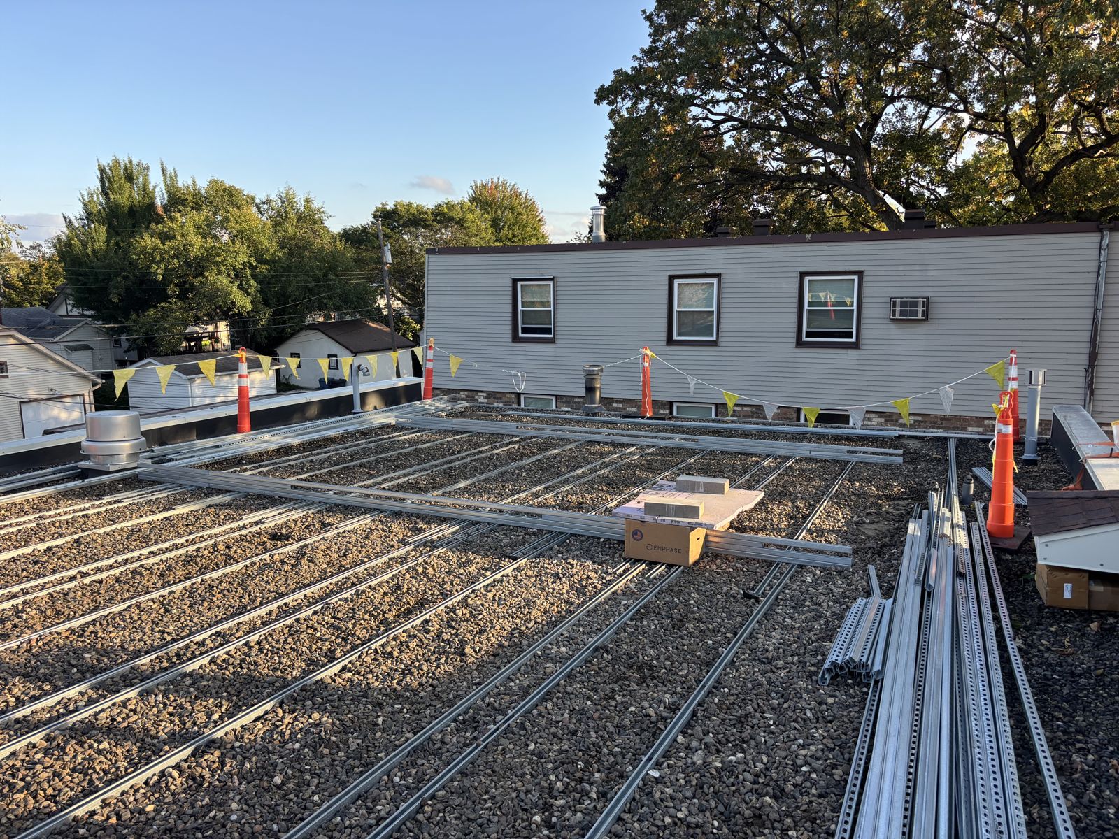 Rows of solar racking ready for panels on a flat commercial roof
